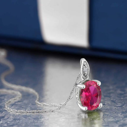 10K White Gold Red Created Ruby and White Diamond Pendant Necklace for Women (2.00 Cttw, Oval 9X7MM, with 18 Inch Chain)