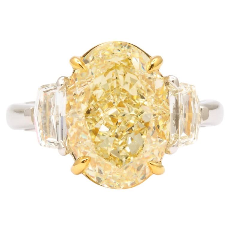 Stunning 6 Carat Oval Yellow Diamond Ring GIA Certified Platinum